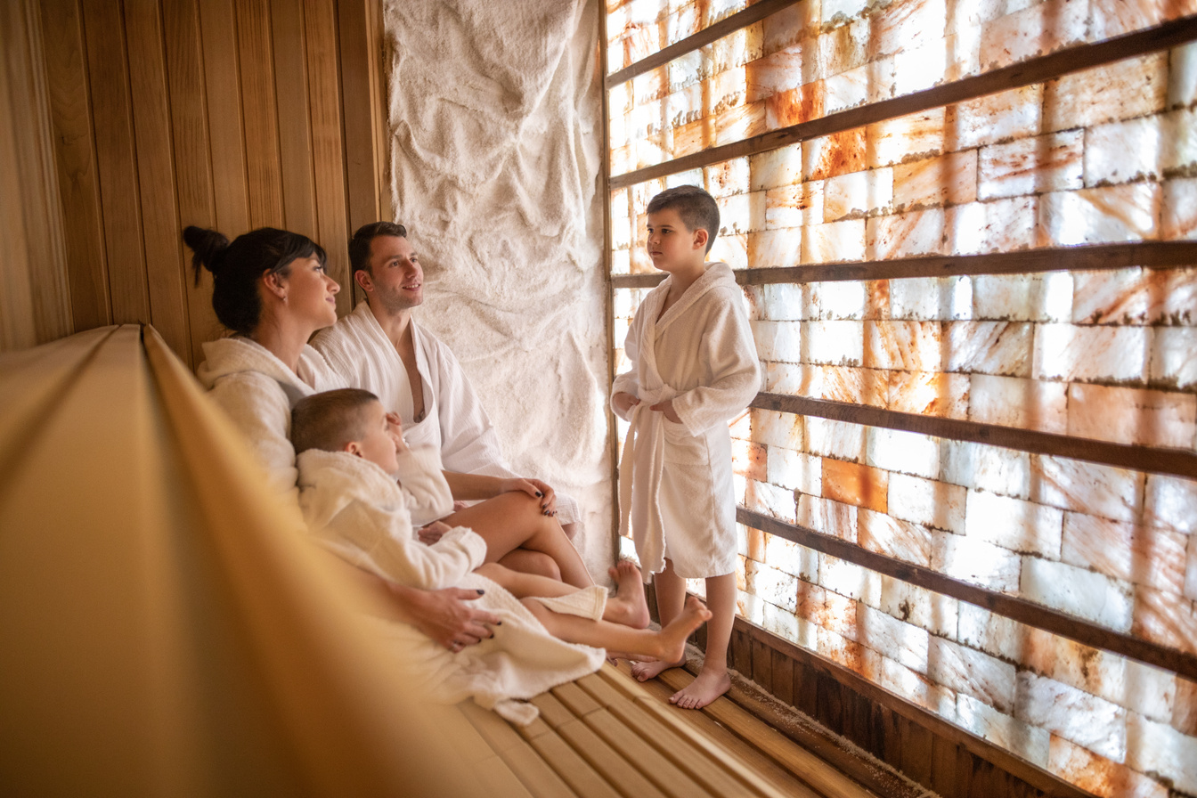 happy family relaxing in salt room